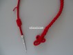 Fangschnur, Musik, Schweiz. Farbe rot mit 1 Metallstift